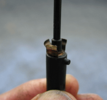 Important for reassembly! Orientation of small tab on plunger in relation to middle ground contact, almost opposite.