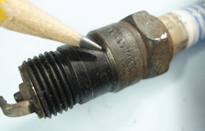 Undertorqued Spark Plug with Gas Leakge