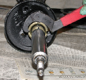 Bench removal of gland nut using hook spanner