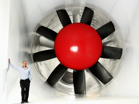 Volvo wind tunnel. Size of fan compared with man